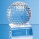 OPTICAL CRYSTAL GOLF BALL MOUNTED ON a CLEAR TRANSPARENT CRYSTAL BASE.