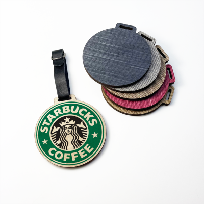 Picture of ROUND GOLF WOOD PLY BAG TAG with Black Leatherette Buckle Strap.