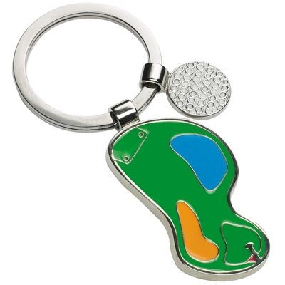 Picture of GOLF BALL AND COURSE METAL KEYRING ON GREEN.