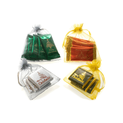 Picture of CHRISTMAS ORGANZA GIFT BAGS WITH CHOCOLATES OR SWEETS.