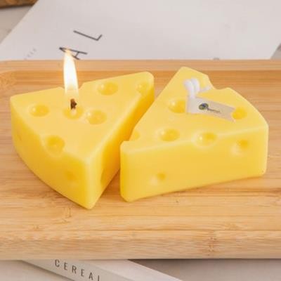 Picture of TRIANGULAR CHEESE SHAPE CANDLE.
